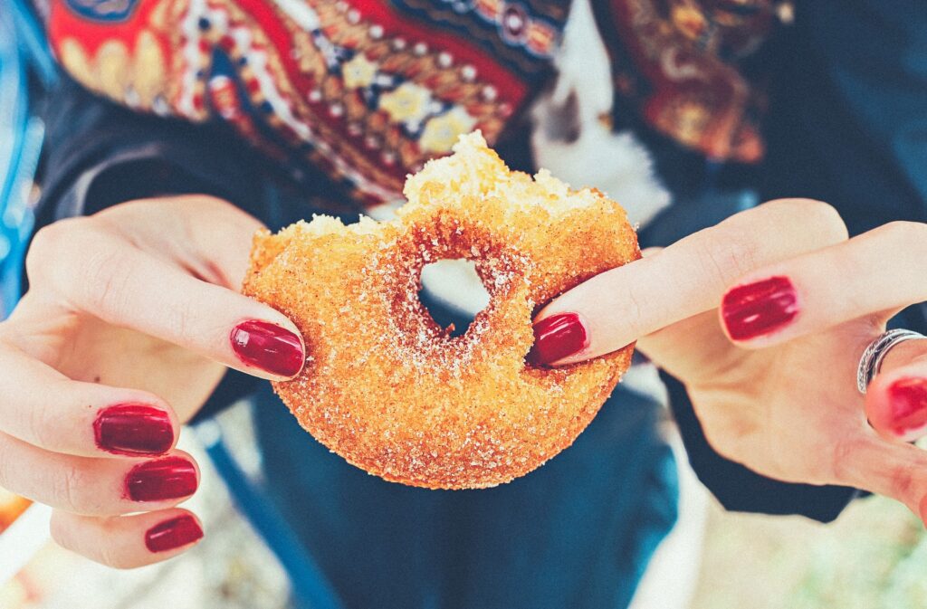 a person holding a donut