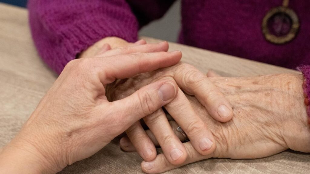 two family members holding hands