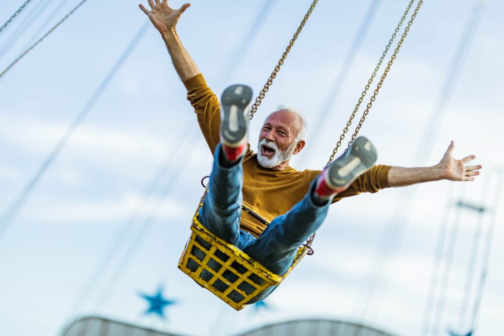 a man on a fair swing