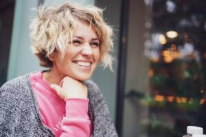 a woman with a sweater on