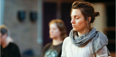 a woman with her eyes closed in meditation